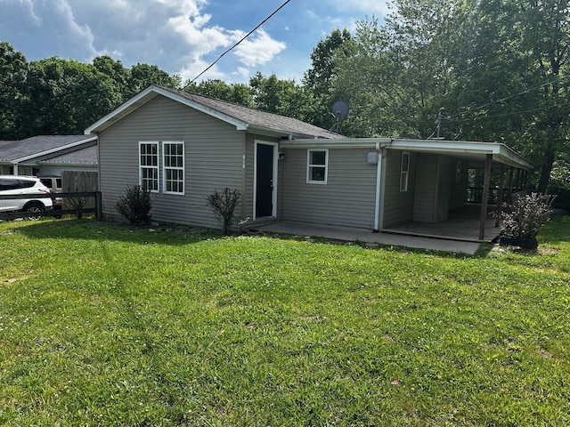 1901 Holly Grove Rd, Corbin, KY 40701 - back of house featuring a lawn