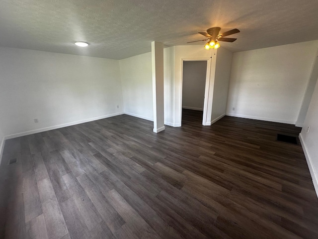 1901 Holly Grove Rd, Corbin, KY 40701 - unfurnished room featuring dark wood finished floors, a ceiling fan, baseboards, and a textured ceiling