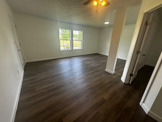 1901 Holly Grove Rd, Corbin, KY 40701 - spare room with baseboards, ceiling fan, and dark wood-type flooring