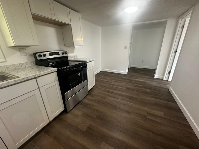1901 Holly Grove Rd, Corbin, KY 40701 - kitchen featuring stainless steel range with electric stovetop, dark wood finished floors, baseboards, and light countertops