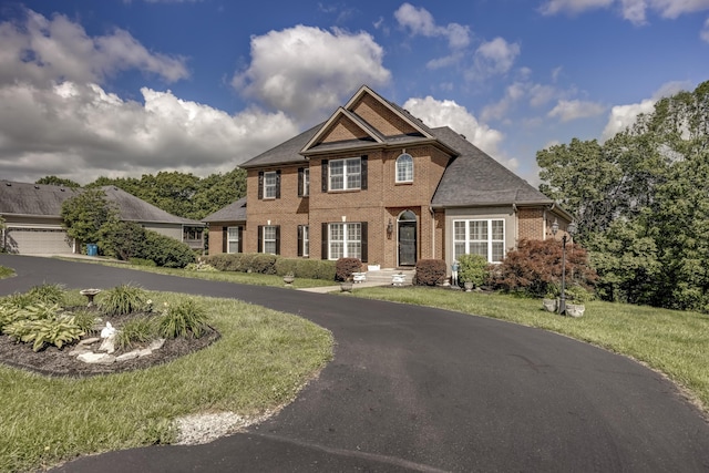 115 Old Bridge Rd, Danville, KY 40422 - view of front of home featuring brick siding, a front lawn, and asphalt driveway