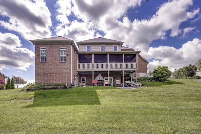 115 Old Bridge Rd, Danville, KY 40422 - back of property with a sunroom, brick siding, and a yard