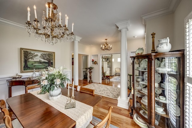 115 Old Bridge Rd, Danville, KY 40422 - dining space featuring a chandelier, decorative columns, light wood-style floors, and crown molding
