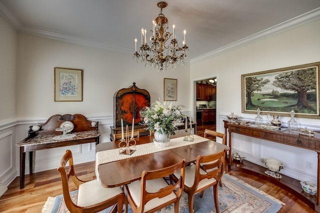 115 Old Bridge Rd, Danville, KY 40422 - dining room featuring a chandelier, ornamental molding, a wainscoted wall, and light wood finished floors