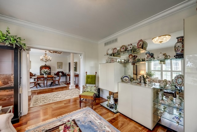 115 Old Bridge Rd, Danville, KY 40422 - living area featuring ornamental molding, a chandelier, and wood finished floors