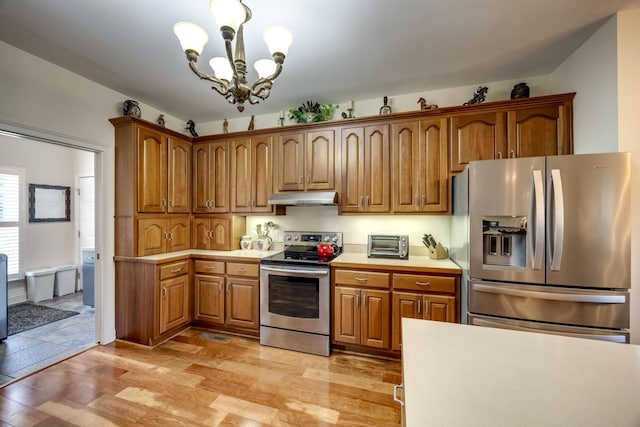 115 Old Bridge Rd, Danville, KY 40422 - kitchen featuring stainless steel appliances, under cabinet range hood, light countertops, and light wood-style flooring