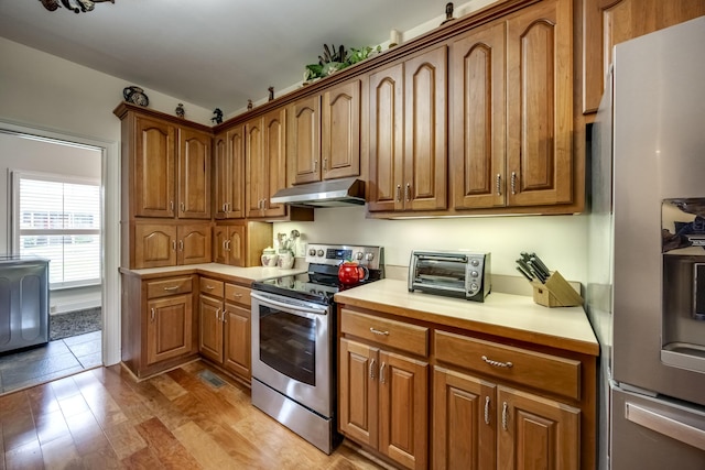 115 Old Bridge Rd, Danville, KY 40422 - kitchen featuring appliances with stainless steel finishes, under cabinet range hood, light countertops, and brown cabinets