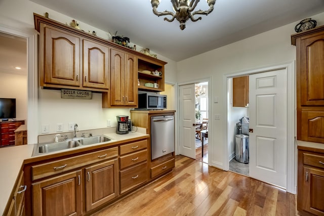 115 Old Bridge Rd, Danville, KY 40422 - kitchen with a sink, stainless steel appliances, light wood-style floors, light countertops, and brown cabinetry
