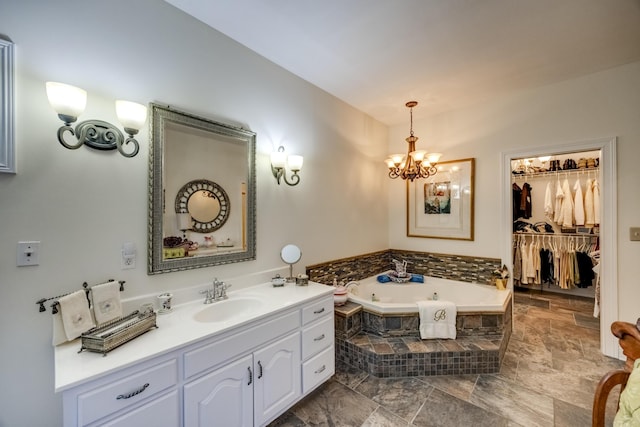 115 Old Bridge Rd, Danville, KY 40422 - full bathroom with vanity, a garden tub, a chandelier, and a walk in closet
