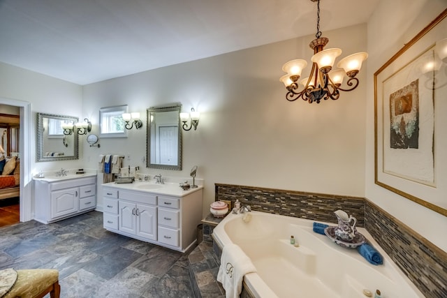 115 Old Bridge Rd, Danville, KY 40422 - full bath featuring a chandelier, a tub with jets, two vanities, and stone finish flooring
