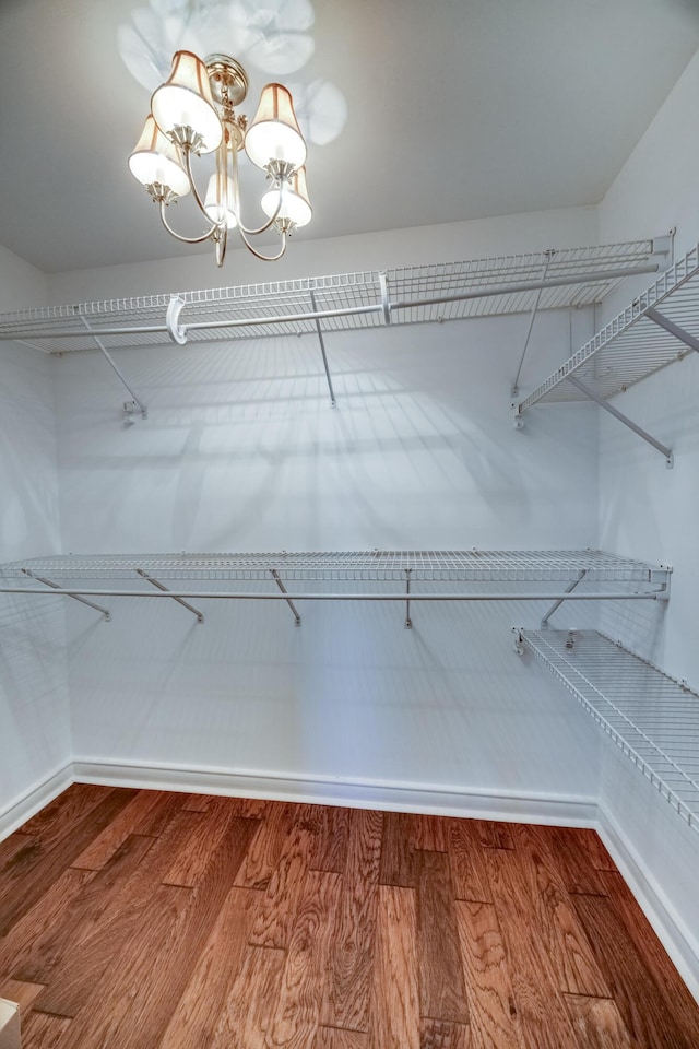 115 Old Bridge Rd, Danville, KY 40422 - walk in closet with wood finished floors and a chandelier