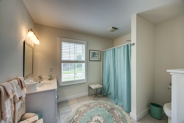 115 Old Bridge Rd, Danville, KY 40422 - full bath featuring vanity, toilet, tile patterned flooring, curtained shower, and baseboards