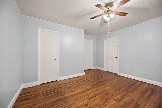 99 Wilson Ln, London, KY 40741 - spare room with a ceiling fan, wood-type flooring, and baseboards