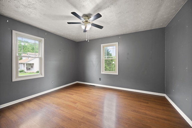 99 Wilson Ln, London, KY 40741 - empty room featuring wood finished floors, a textured ceiling, a ceiling fan, and baseboards