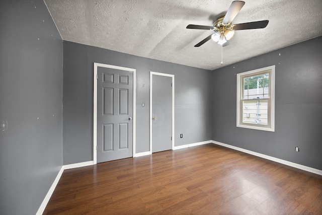 99 Wilson Ln, London, KY 40741 - unfurnished bedroom featuring wood finished floors, a textured ceiling, baseboards, and ceiling fan