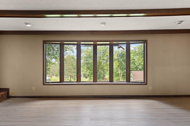99 Wilson Ln, London, KY 40741 - unfurnished room featuring healthy amount of natural light, wood finished floors, and baseboards