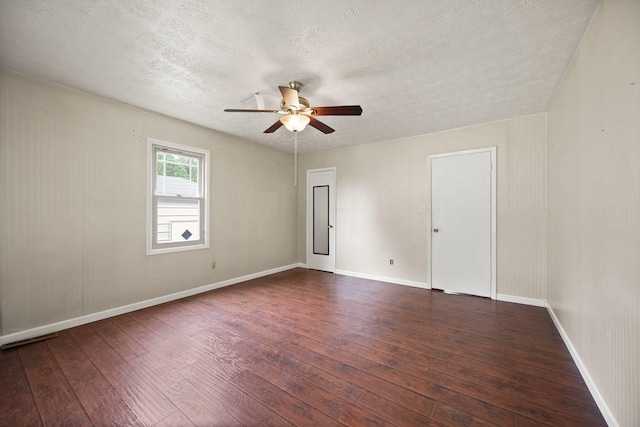 99 Wilson Ln, London, KY 40741 - spare room with wood-type flooring, a textured ceiling, a ceiling fan, and baseboards