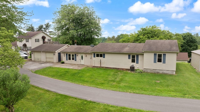 99 Wilson Ln, London, KY 40741 - view of front of home featuring asphalt driveway, a front yard, central AC, and a garage