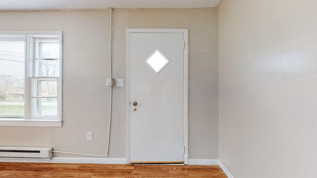 220 Johnson Ln, Berea, KY 40403 - foyer featuring a baseboard heating unit, wood finished floors, and baseboards