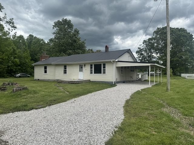 220 Johnson Ln, Berea, KY 40403 - view of front of home with gravel driveway, a chimney, metal roof, and a front lawn