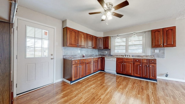 220 Johnson Ln, Berea, KY 40403 - kitchen with white dishwasher, a ceiling fan, light wood finished floors, tasteful backsplash, and baseboards