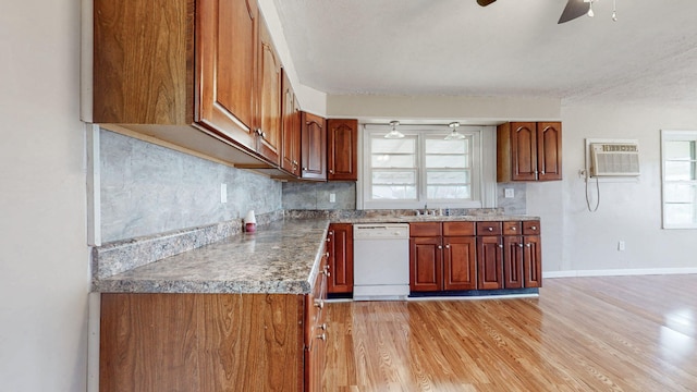 220 Johnson Ln, Berea, KY 40403 - kitchen featuring dishwasher, a ceiling fan, a sink, a wall mounted AC, and light wood-type flooring