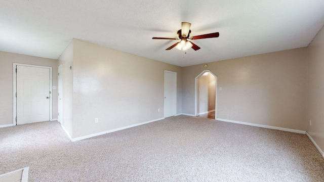 220 Johnson Ln, Berea, KY 40403 - unfurnished room featuring ceiling fan, arched walkways, carpet, and baseboards