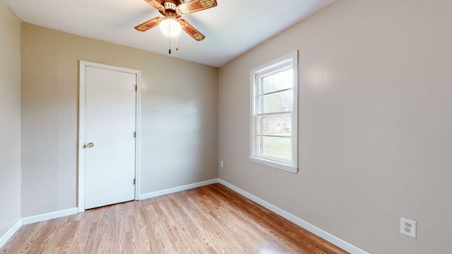 220 Johnson Ln, Berea, KY 40403 - spare room featuring light wood-style floors, a ceiling fan, and baseboards