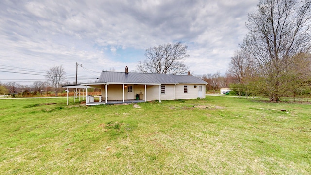 220 Johnson Ln, Berea, KY 40403 - rear view of house featuring a lawn, metal roof, a chimney, and a porch