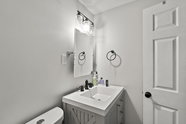 126 Frankie Dr, Richmond, KY 40475 - half bath featuring toilet, vanity, and a textured ceiling