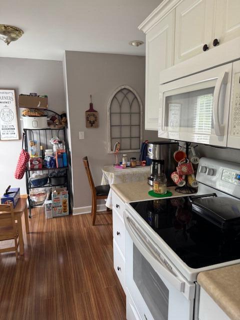 77 Bethy Rd, London, KY 40744 - kitchen with white appliances, light countertops, white cabinetry, and dark wood finished floors