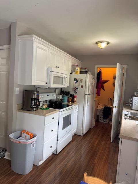 77 Bethy Rd, London, KY 40744 - kitchen with white appliances, dark wood finished floors, white cabinets, and light countertops