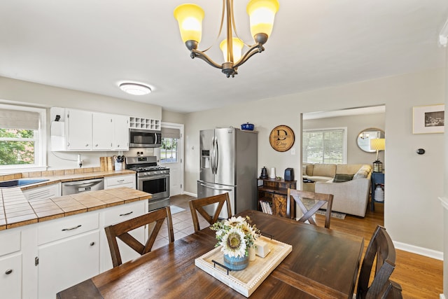 298 Hill N Dale Rd, Lexington, KY 40503 - dining room with a chandelier and baseboards