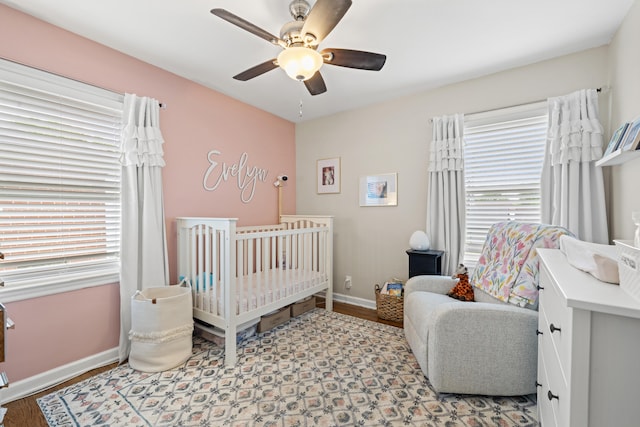 298 Hill N Dale Rd, Lexington, KY 40503 - bedroom with multiple windows, a nursery area, baseboards, and a ceiling fan