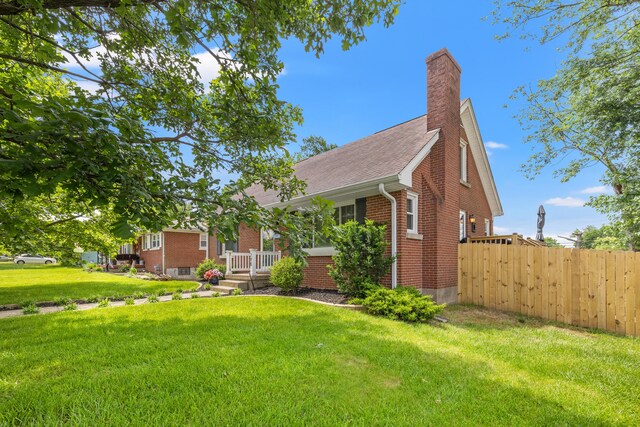 298 Hill N Dale Rd, Lexington, KY 40503 - view of front of property with brick siding, a chimney, and roof with shingles