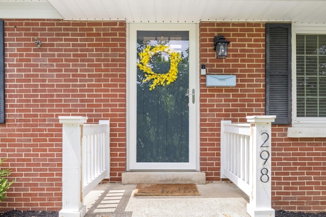 298 Hill N Dale Rd, Lexington, KY 40503 - view of exterior entry with brick siding and a porch