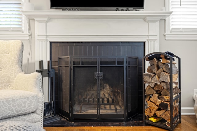 298 Hill N Dale Rd, Lexington, KY 40503 - detailed view of a brick fireplace, wood finished floors, and baseboards