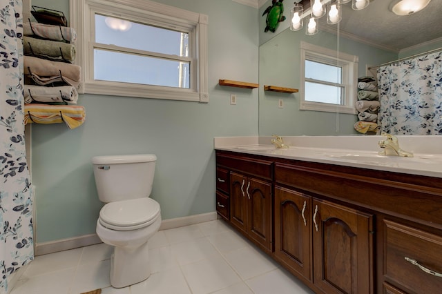 150 Stone Crest Rd, Winchester, KY 40391 - bathroom featuring crown molding, double vanity, baseboards, toilet, and tile patterned floors