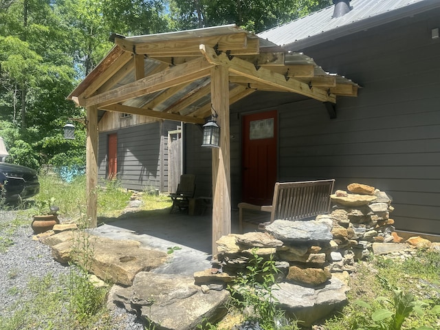 853 Rock Springs Rd, Celina, TN 38551 - property entrance featuring metal roof and a patio area