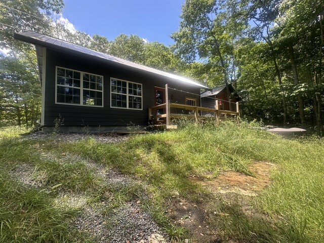 853 Rock Springs Rd, Celina, TN 38551 - rear view of property featuring metal roof and a wooden deck