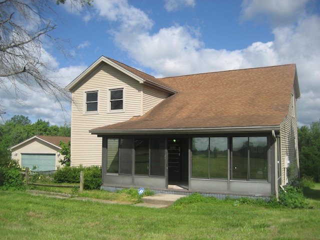 2960 Old Bloomfield Rd, Bloomfield, KY 40008 - back of house with a sunroom, a garage, roof with shingles, and a yard