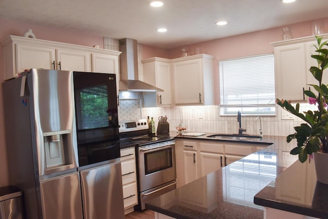 200 Manoah Ln, Nicholasville, KY 40356 - kitchen with stainless steel appliances, wall chimney range hood, a sink, recessed lighting, and white cabinets