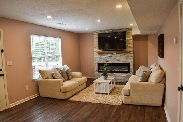 200 Manoah Ln, Nicholasville, KY 40356 - living room featuring a textured ceiling, baseboards, a fireplace, wood finished floors, and recessed lighting