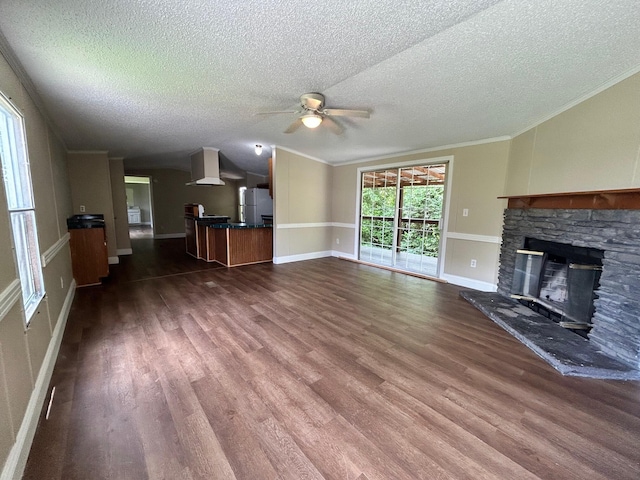 376 Cumberland Dr, Burnside, KY 42519 - unfurnished living room featuring ceiling fan, a textured ceiling, wood finished floors, a fireplace, and lofted ceiling