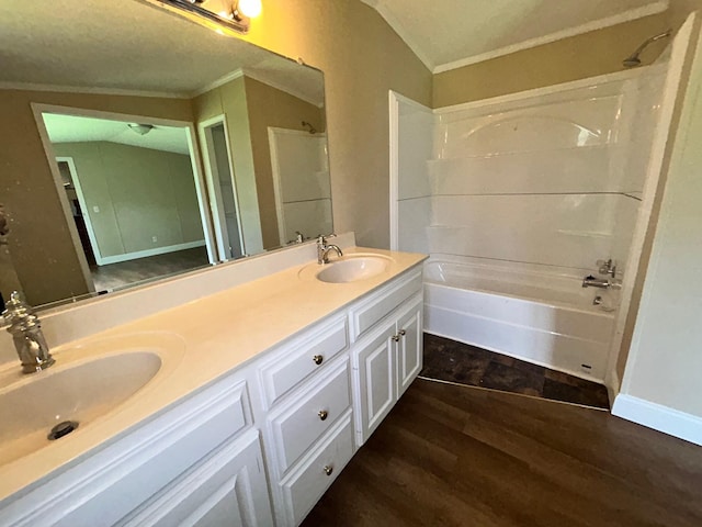 376 Cumberland Dr, Burnside, KY 42519 - full bathroom featuring crown molding, double vanity, wood finished floors, and bathing tub / shower combination