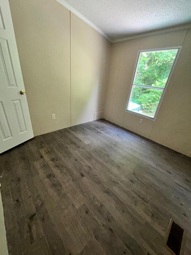 376 Cumberland Dr, Burnside, KY 42519 - empty room with dark wood-style floors, ornamental molding, and a textured ceiling