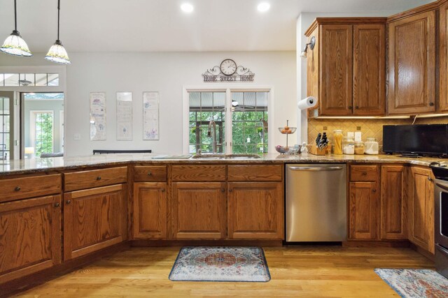 512 Water Cliff Dr, Somerset, KY 42503 - kitchen featuring stainless steel dishwasher, a sink, light wood finished floors, light stone counters, and recessed lighting