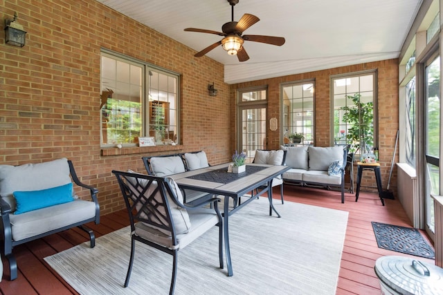 512 Water Cliff Dr, Somerset, KY 42503 - sunroom featuring outdoor lounge area, brick wall, hardwood / wood-style floors, a ceiling fan, and a wooden deck