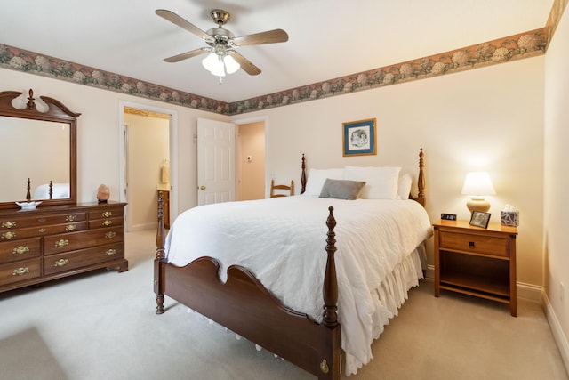 512 Water Cliff Dr, Somerset, KY 42503 - bedroom with light colored carpet, baseboards, connected bathroom, and a ceiling fan