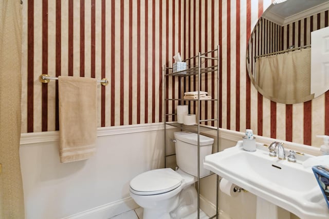 512 Water Cliff Dr, Somerset, KY 42503 - bathroom with wallpapered walls, toilet, a sink, tile patterned flooring, and baseboards